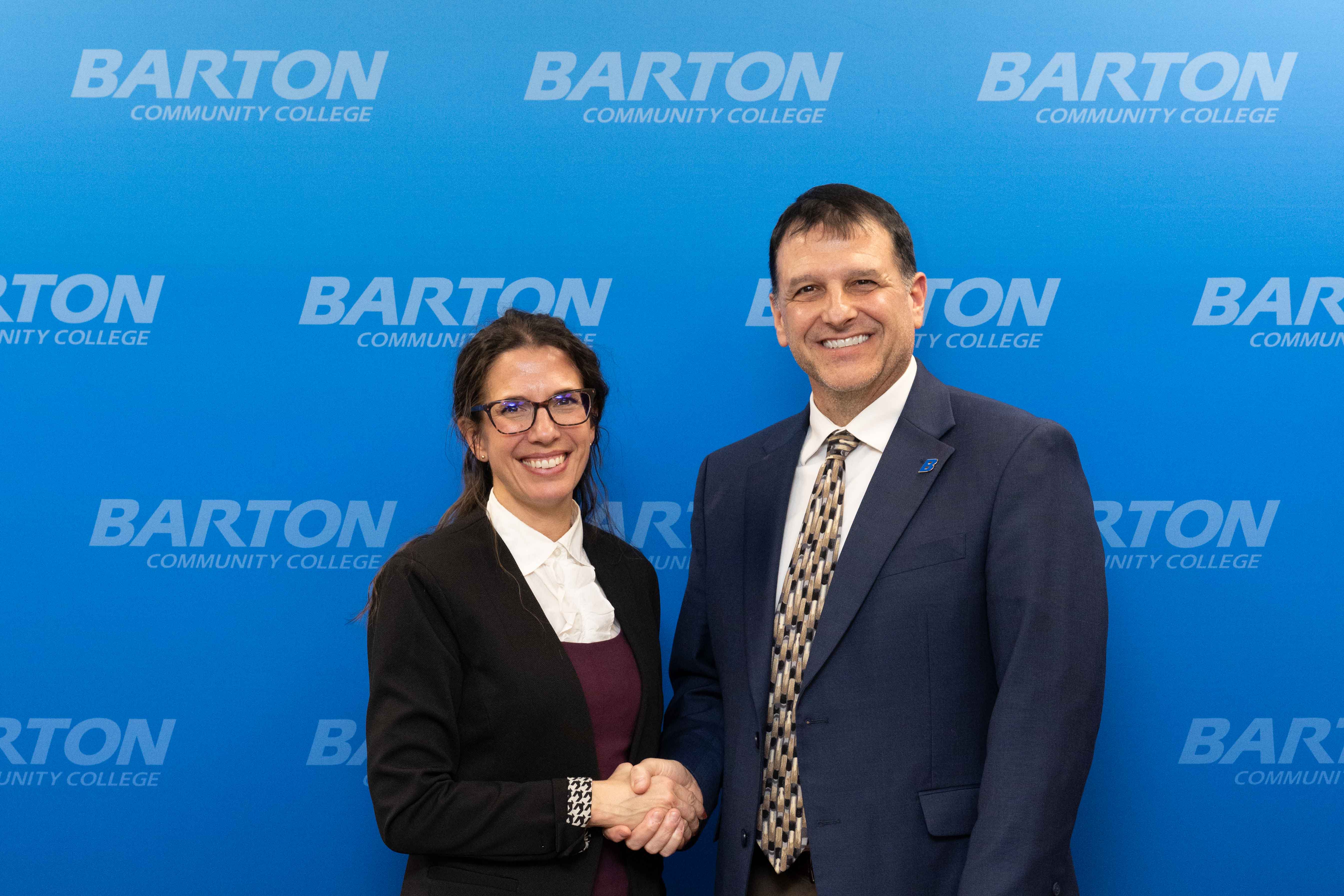 woman and man shaking hands