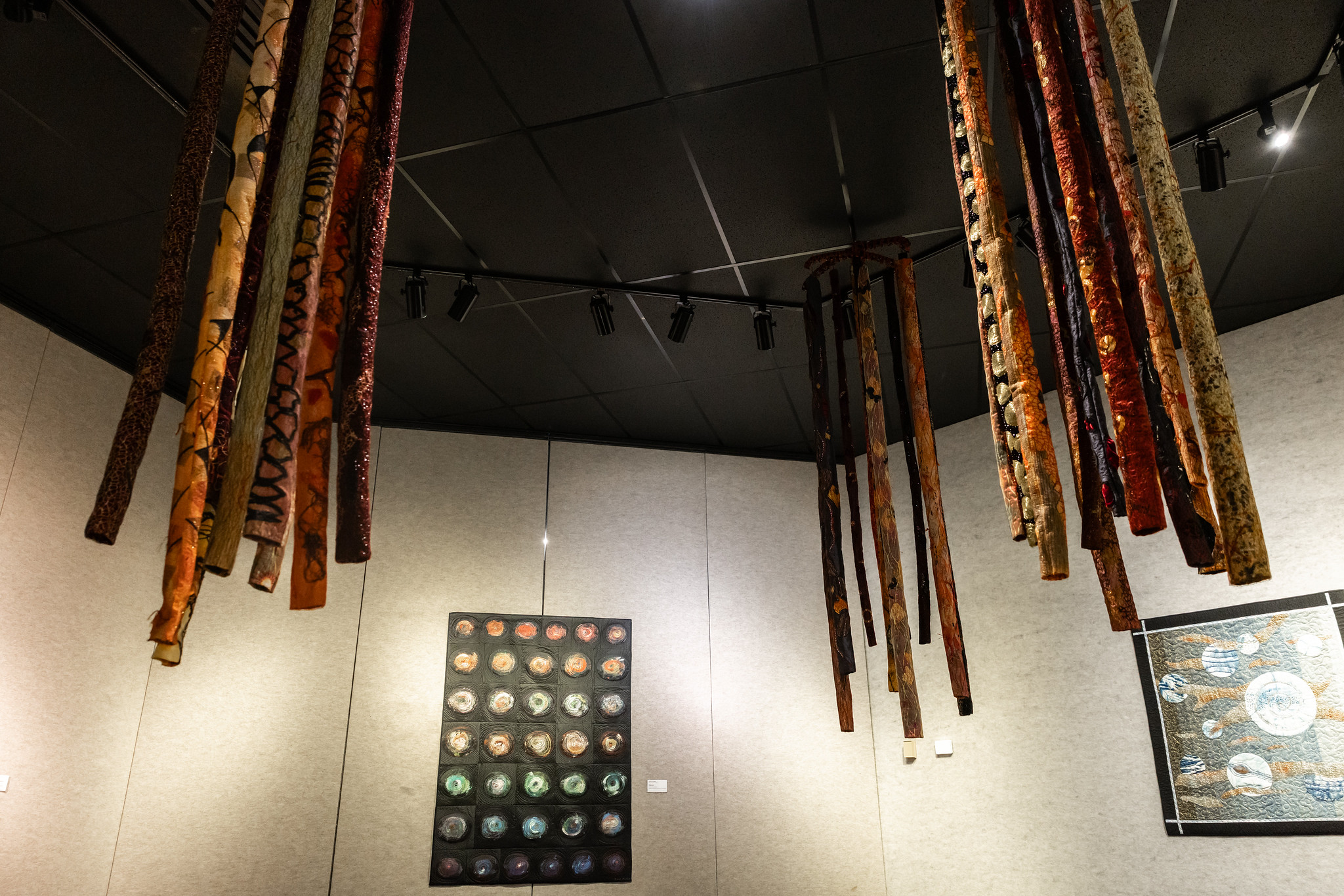 things hanging from ceiling with art