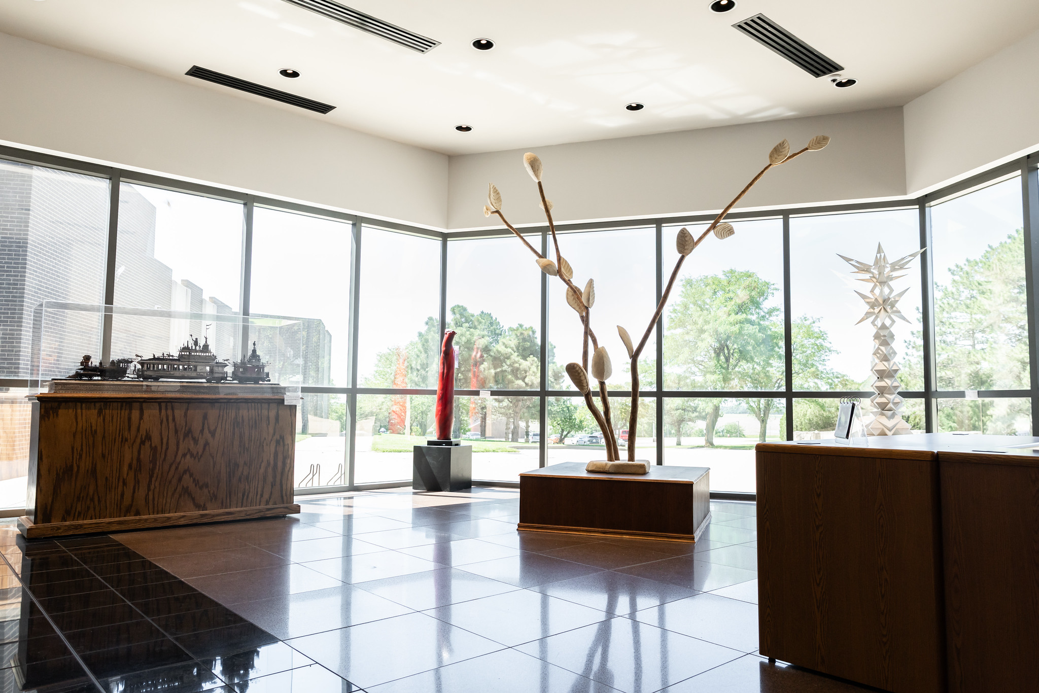 lobby with multiple windows and tree like art