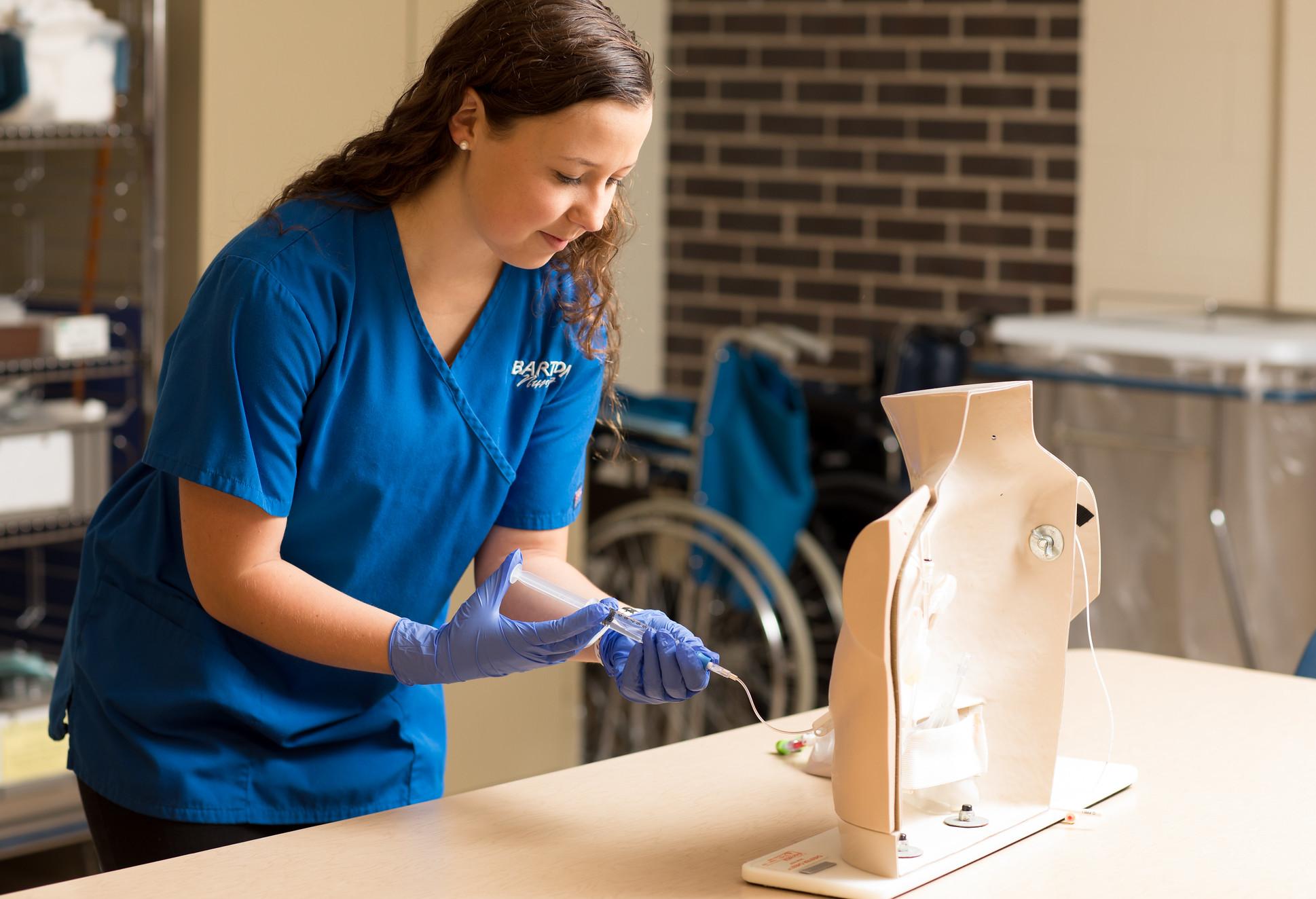 Nurse training on a mannequin