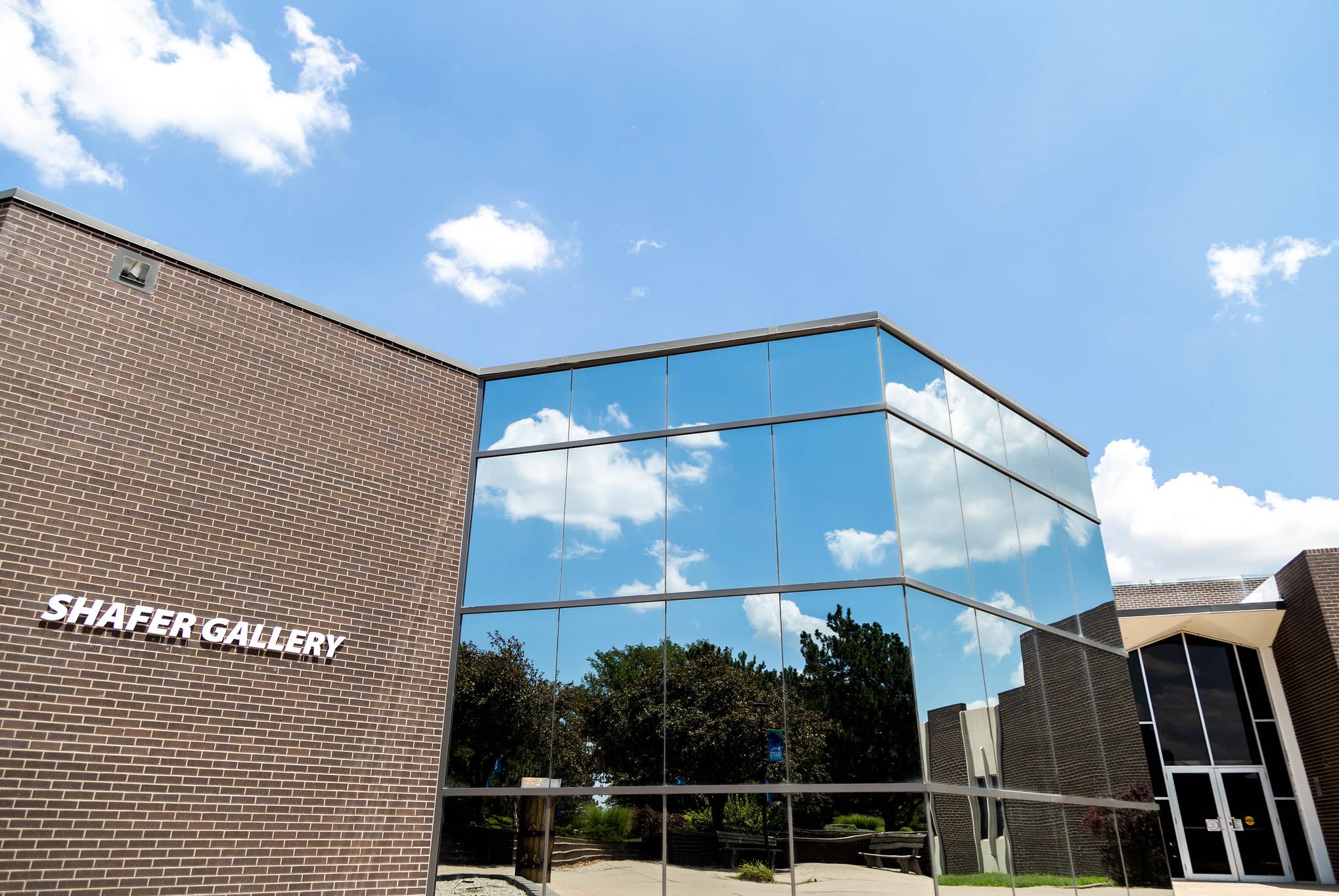 brick building with impressive glass windows