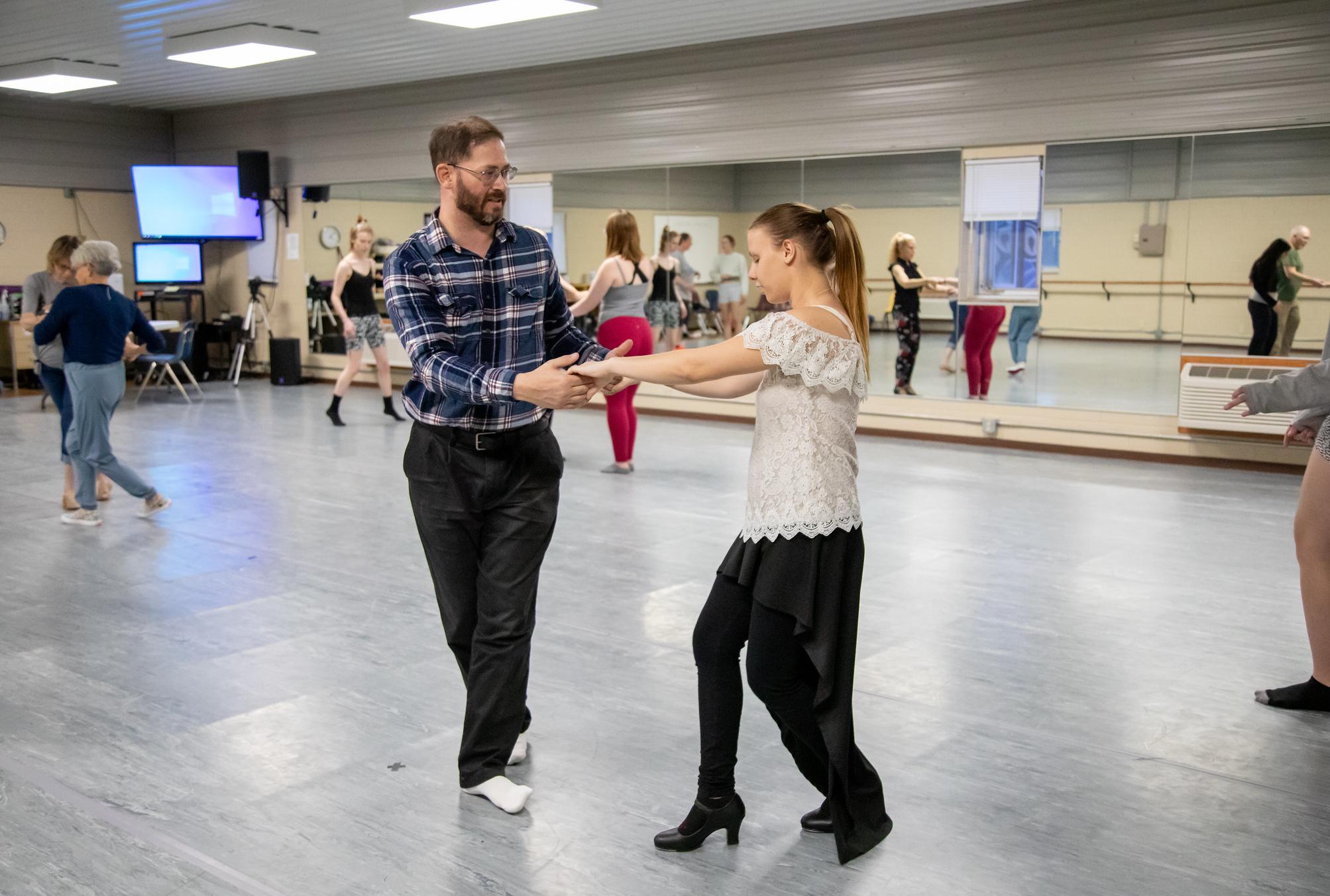 people dancing in a studio