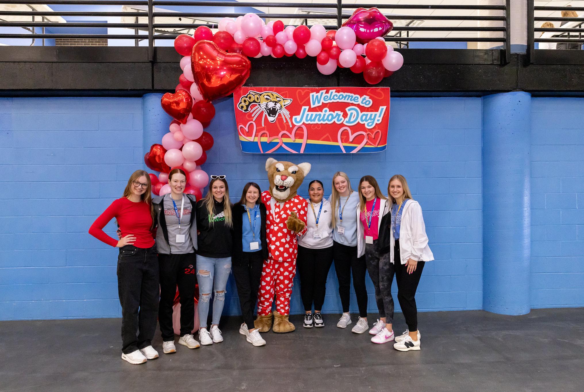 students standing with bart the cougar mascot 
