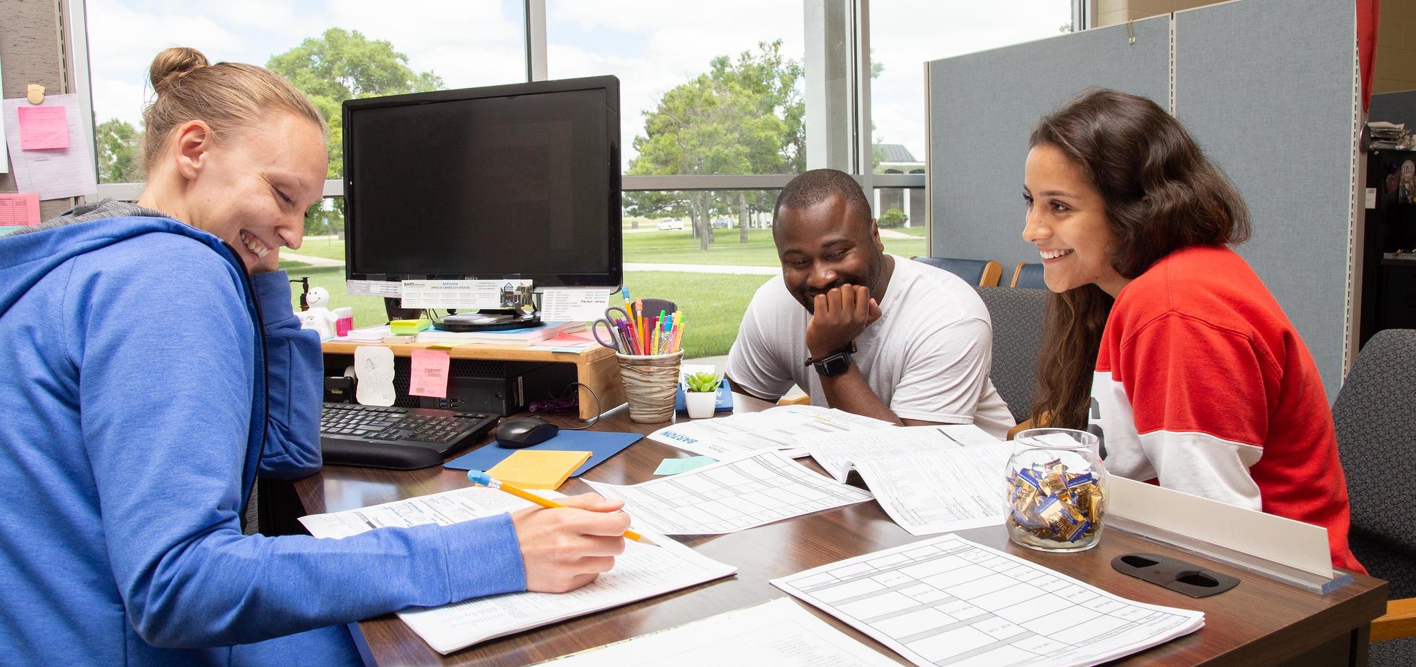 Advisor works with students