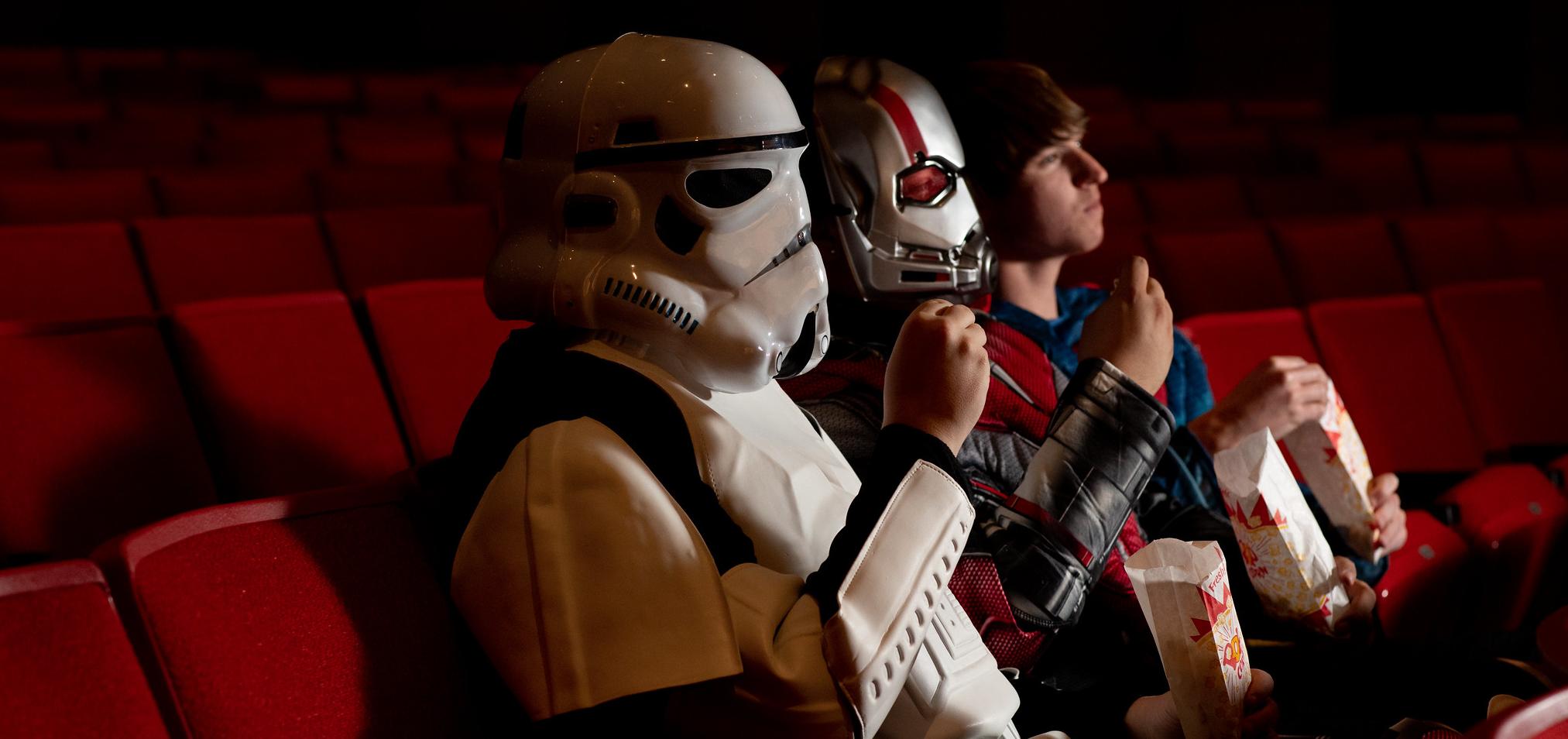 Students watch a movie in the auditorium