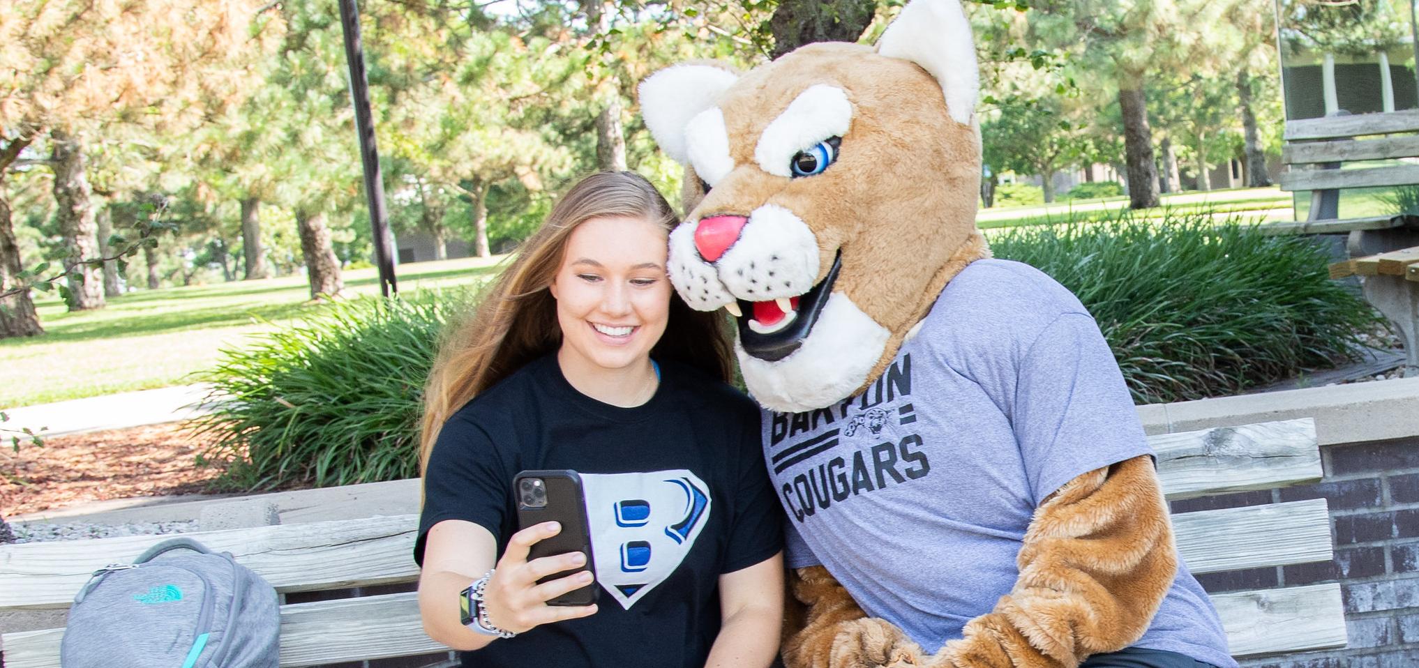 Bart takes a selfie with a student
