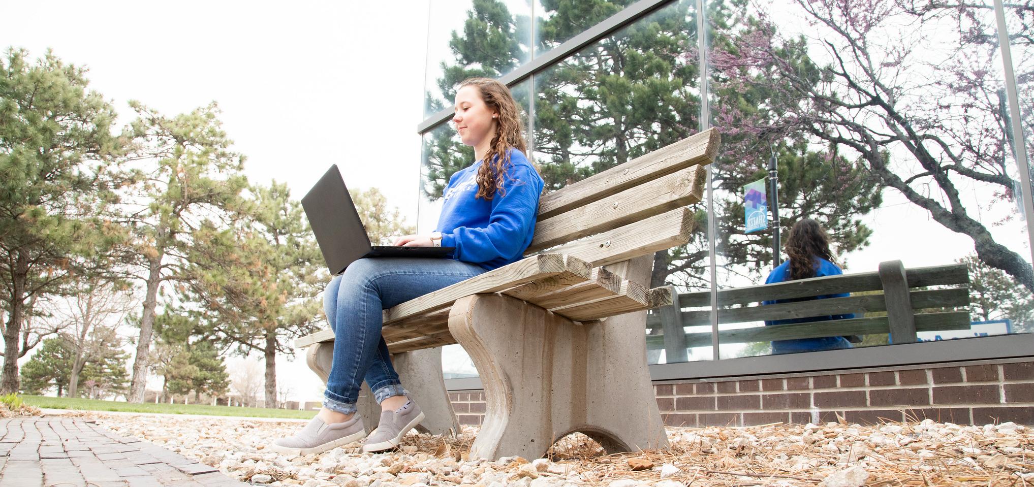 Student works on their computer