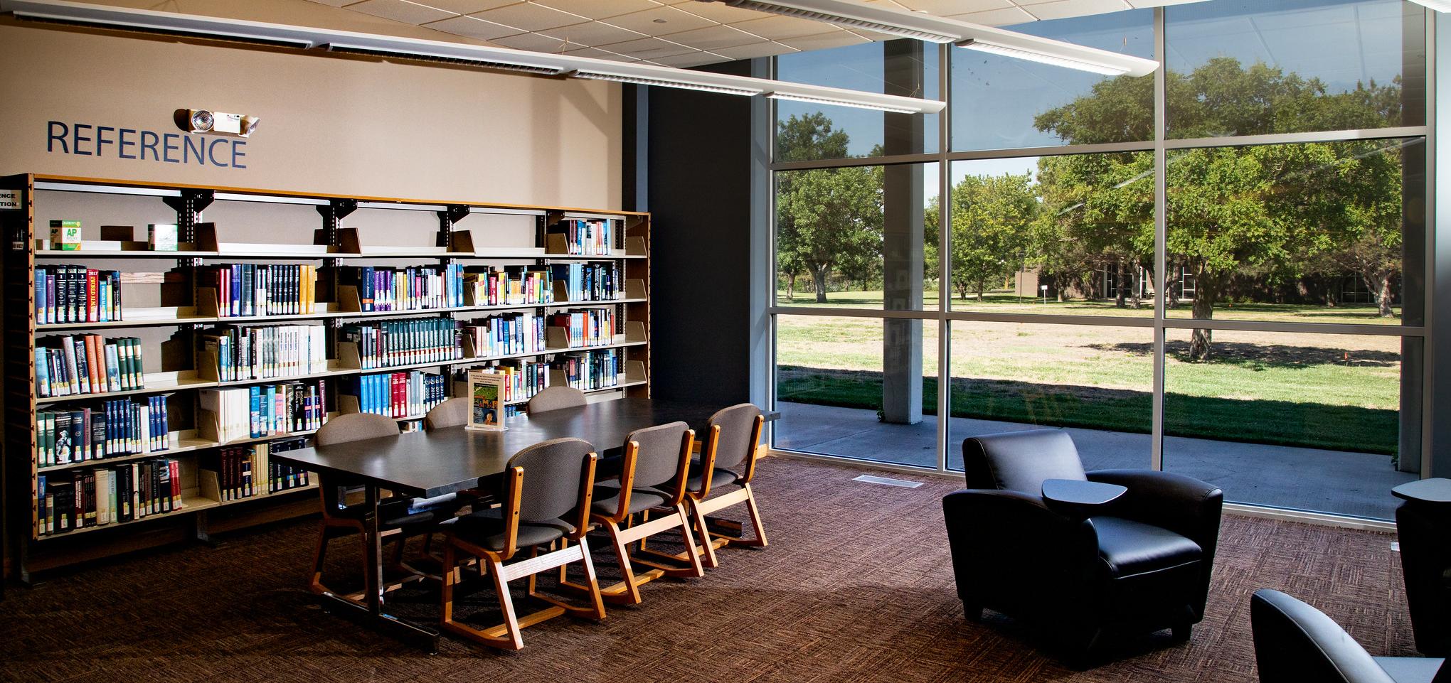 Wall of reference materials in Library