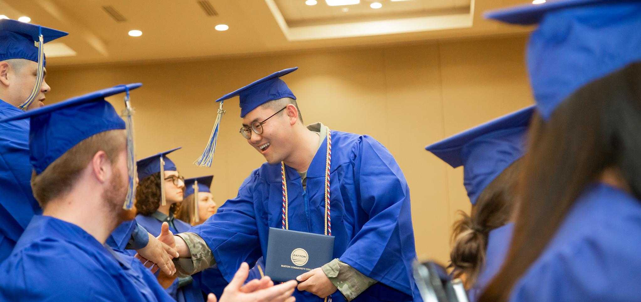 Students on military base celebrate after graduation