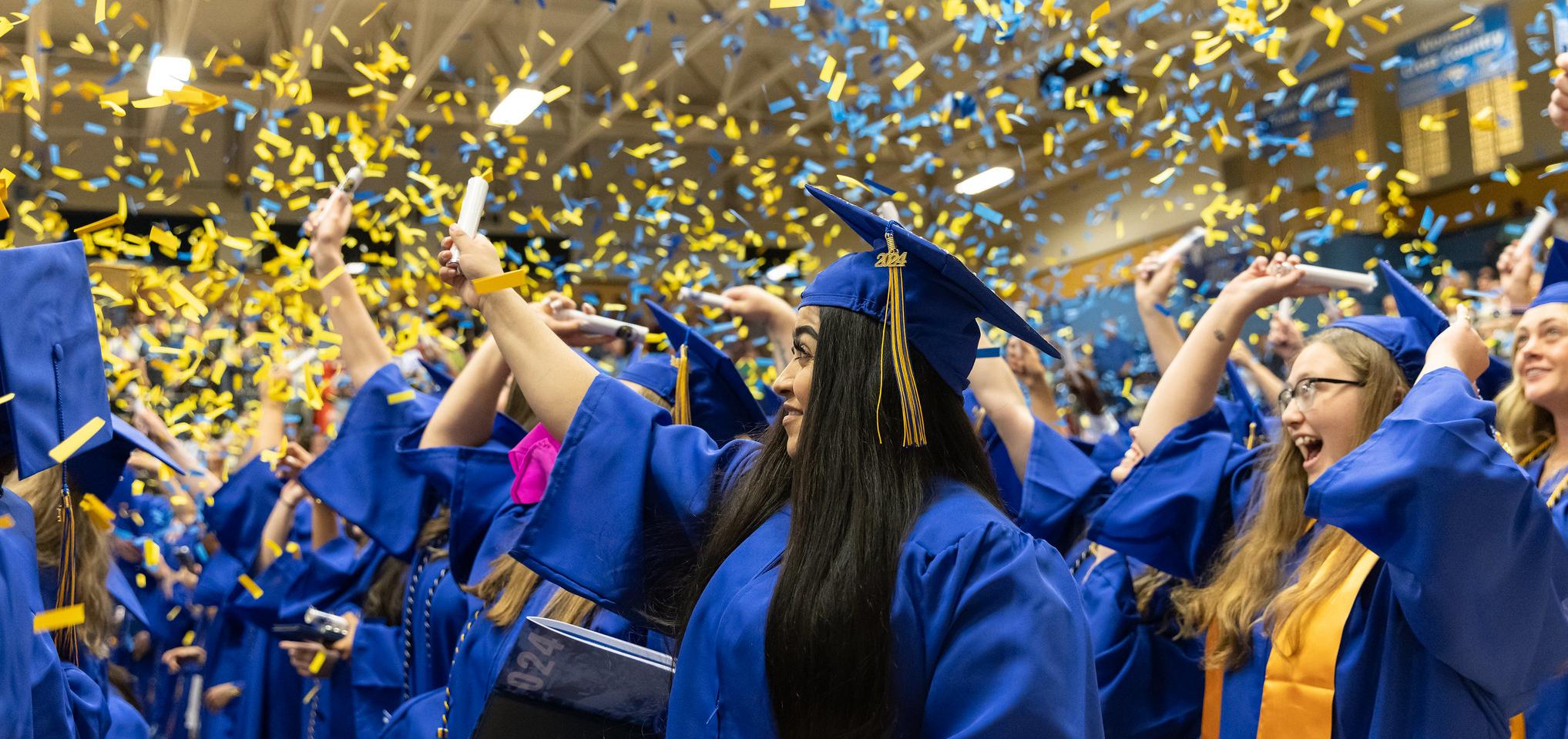 Students throw confetti at 2024 graduation ceremony