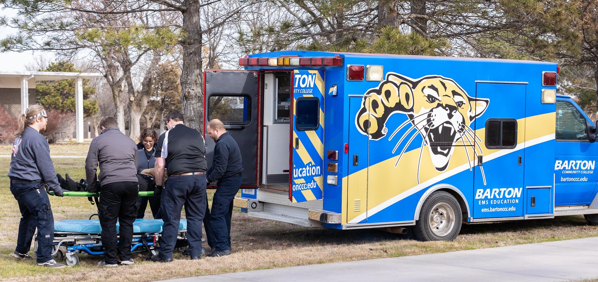 Students and instructors conduct training with the EMS ambulance