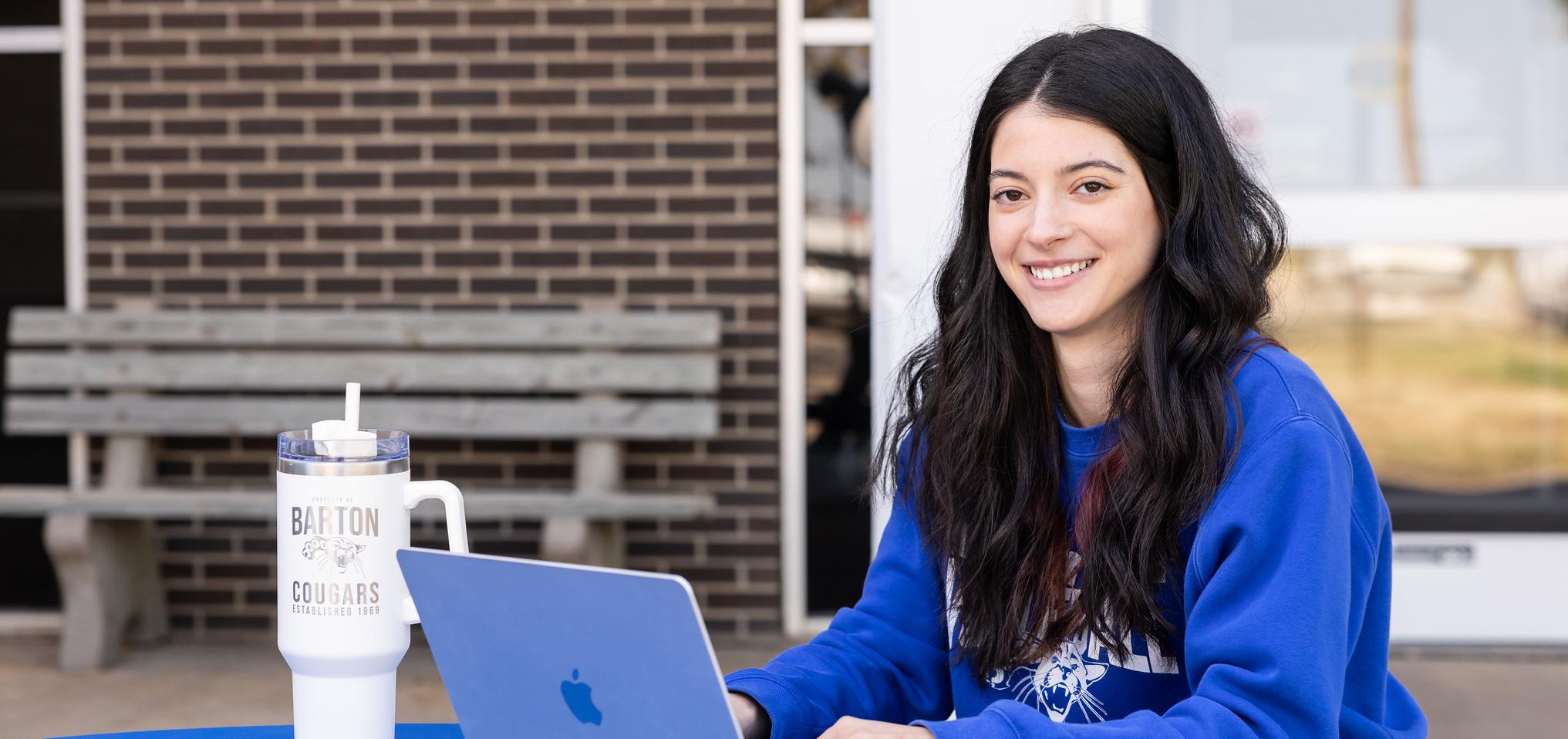 Student works on their computer